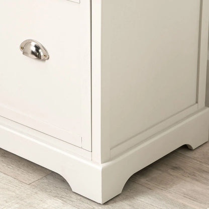 Warm Ivory Pine Wood 5 Drawer Tall Boy Chest of Drawers with Polished Silver Cup Handles close-up of bottom right, handle and plinth 108x41x33cm | Click Style
