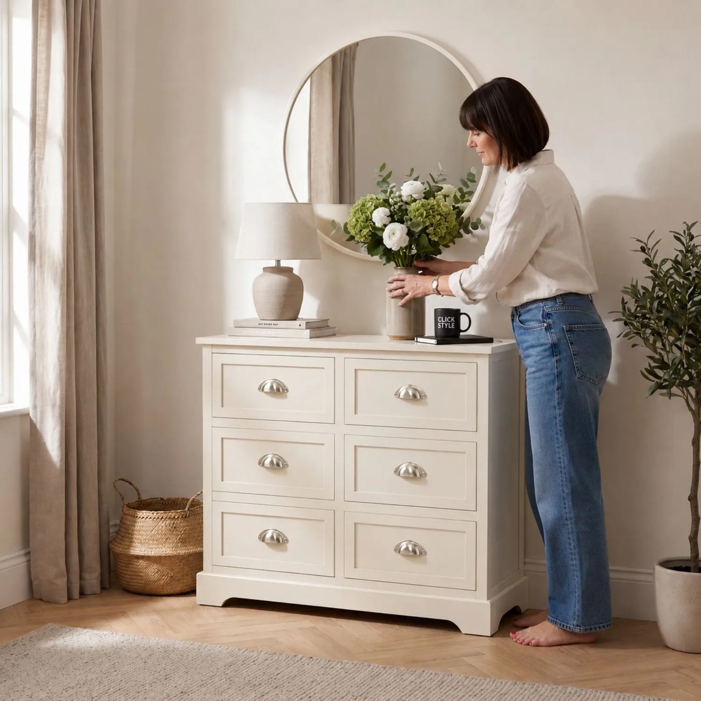 Warm Ivory Pine Wood 6 Drawer Chest of Drawers with Polished Silver Cup Handles styled in a neutral home with woman arranging flowers 70x76x33cm | Click Style