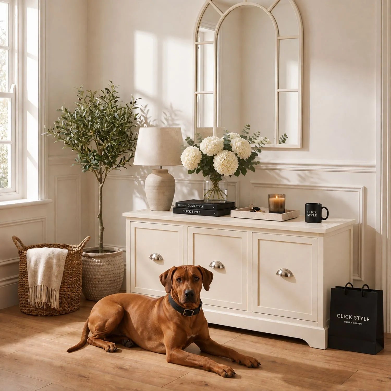 Warm Ivory Pine Wood Low 3 Drawer Storage Unit with Polished Silver Cup Handles styled in a neutral living room with a Rhodesian Ridgeback and lit candle 48x107x39cm | Click Style