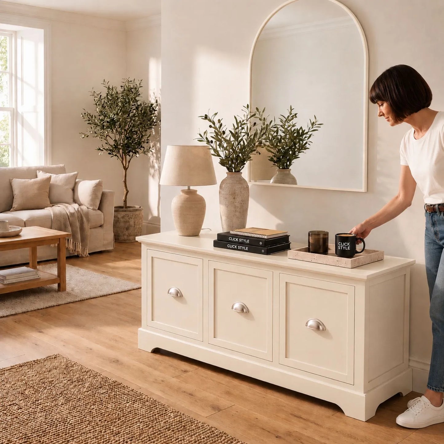 Warm Ivory Pine Wood Low 3 Drawer Storage Unit with Polished Silver Cup Handles styled in a neutral living room with a woman in blue jeans holding a Click Style mug 48x107x39cm | Click Style