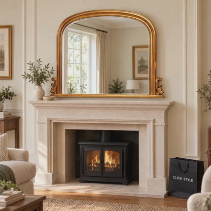 Large Antique Gold Overmantel Mirror with Arched Top & Ornate Scrollwork – Bevelled Glass Gold Leaf Effect Mantle Mirror 94x118x6cm displayed above a traditional limestone fireplace in an elegant British living room, with gentle flames flickering in the wood-burning stove | Click Style