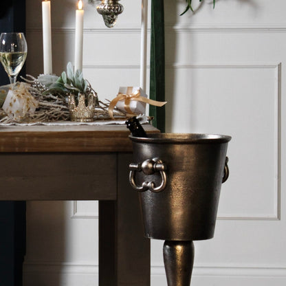 Tall silver champagne cooler and bucket