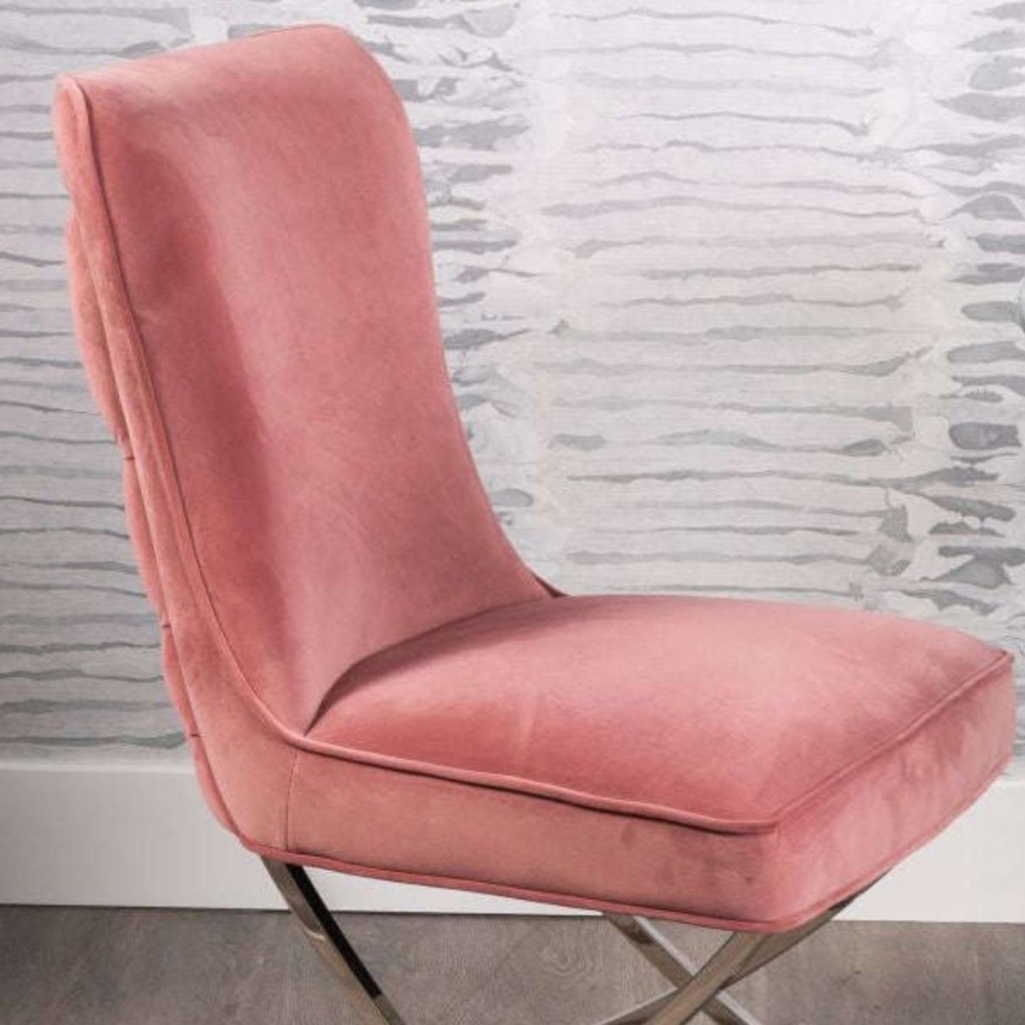 Pair of pink buttoned dining chairs with curved silver legs