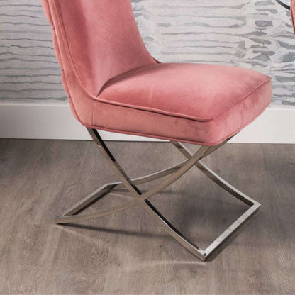Pair of pink buttoned dining chairs with curved silver legs
